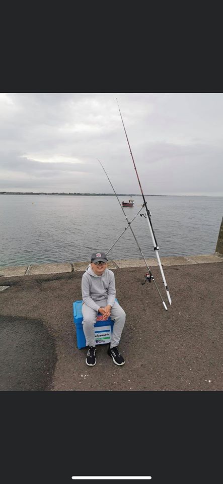 Young Logan Farr sets the traps at Ballyhalbert pier